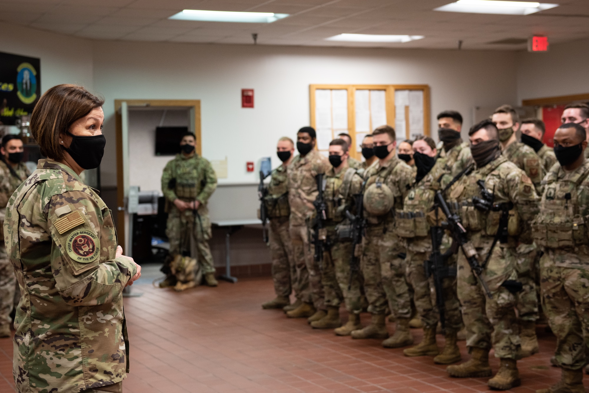 Chief Master Sergeant of the Air Force JoAnne S. Bass, speaks with Airmen assigned to the 509th Security Forces Squadron at Whiteman Air Force Base, Missouri, Nov. 10, 2020. The 509th SFS provides security for all personnel, protection-level resources and other base assets assigned to the 509th Bomb Wing and tenant units on Whiteman Air Force Base. (U.S. Air Force photo by Airman 1st Class Christina Carter)