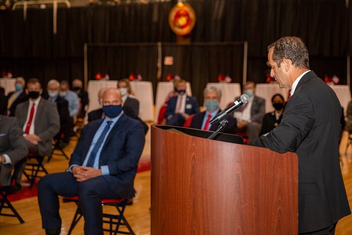 Michael Lazzara, right, Jacksonville Mayor pro tempore and the guest of honor, gives a speech during the Marine Corps Installations East-Marine Corps Base Camp Lejeune cake cutting ceremony at the Goettge Memorial Field House on MCB Camp Lejeune, North Carolina, Nov. 10, 2020. Marines with MCIEAST-MCB Camp Lejeune celebrated the 245th Marine Corps birthday by reading the birthday message from Gen. John A. Lejeune, 13th Commandant of the Marine Corps and cutting the traditional birthday cake while adhering to COVID-19 mitigation protocols. (U.S. Marine Corps photo by Lance Cpl. Christian Ayers)
