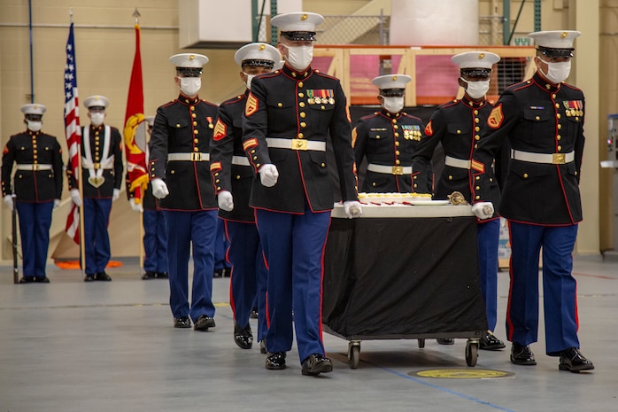 U.S. Marines with the Center for Naval Aviation Technical Training (CNATT) march out the cake at the 245th Marine Corps birthday cake cutting ceremony on Marine Corps Air Station New River, North Carolina, Nov. 10, 2020. A celebration for the Marine Corps birthday is held every year to reflect on the traditions, history and legacy of the Marine Corps. Due to COVID-19, this year’s celebration was held with increased regulations and safety precautions. (U.S. Marine Corps Photo by Lance Cpl. Isaiah Gomez)