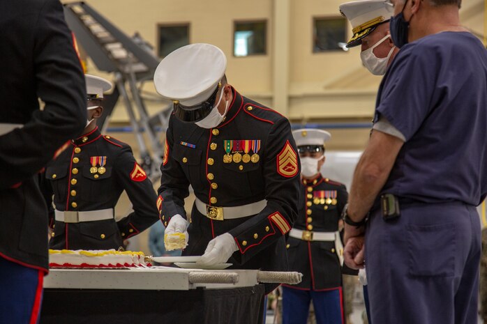 U.S. Marines with the Center for Naval Aviation Technical Training (CNATT) cut the cake at the 245th Marine Corps birthday cake cutting ceremony on Marine Corps Air Station New River, North Carolina, Nov. 10, 2020. A celebration for the Marine Corps birthday is held every year to reflect on the traditions, history and legacy of the Marine Corps. Due to COVID-19, this year’s celebration was held with increased regulations and safety precautions. (U.S. Marine Corps Photo by Lance Cpl. Isaiah Gomez)