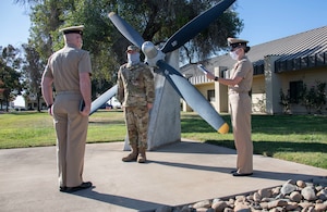 Staff Sgt. Thomas Waters receives the Navy and Marine Corps Achievement Medal.