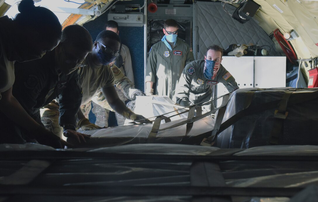 U.S. Air Force Airmen from the 92nd Air Refueling Wing load cargo during a humanitarian relief mission at Travis Air Force Base, California, Nov. 8, 2020. Over the span of a week, aircrews from Fairchild enabled the movement of humanitarian supplies, making them one of many delivery support functions within AMC. Fairchild’s role multiplied cargo carriers cutting down on invaluable delivery time. (U.S. Air Force by Staff Sgt. Jesenia Landaverde)