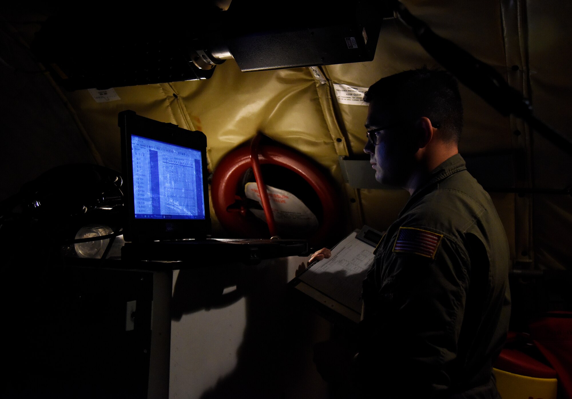 U.S. Air Force Tech. Sgt. Carl Ditty, 92nd Maintenance Group crew chief, performs aircraft check during a humanitarian relief mission at Joint Base Pearl Harbor-Hickam, Hawaii, Nov. 8, 2020. Fairchild Airmen have provided for the nation’s defense for more than seventy years.  Fame’s Favored Few will continue executing cargo missions to expand global reach, going beyond the typical area of day-to-day operations and training. (U.S. Air Force photo by Staff Sgt. Jesenia Landaverde)