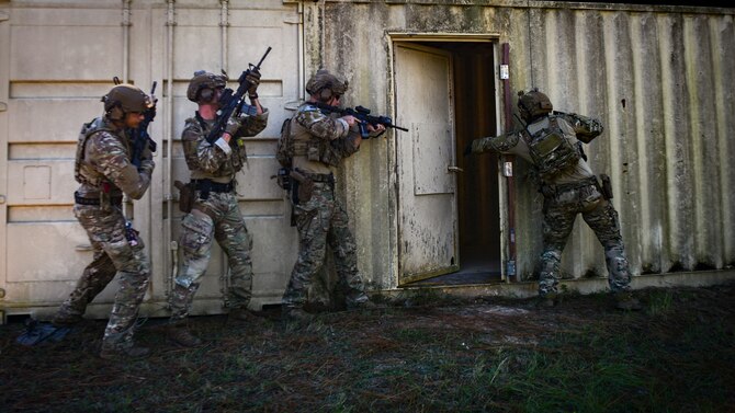 Air Commandos with the 1st Special Operations Civil Engineer Squadron and 1st Special Operations Security Forces Squadron clear a building during a full training exercise at Hurlburt Field, Florida, Nov. 4, 2020. More than 20 explosive ordnance disposal and deployed aircraft ground response element Airmen conducted a three-day FTX simulating realistic deployed operations to ensure Air Commandos are ready any time, any place. (U.S. Air Force photo by Airman 1st Class Blake Wiles)