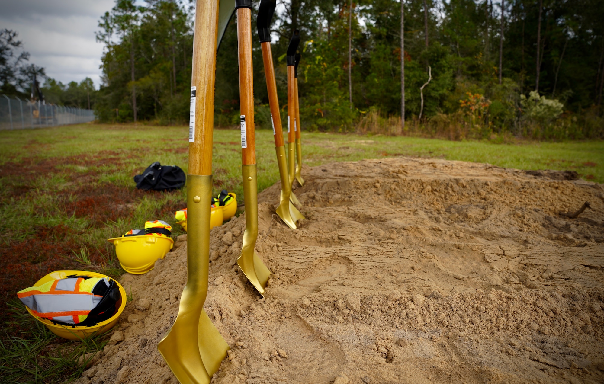 Photo of shovels standing in a mound of dirt