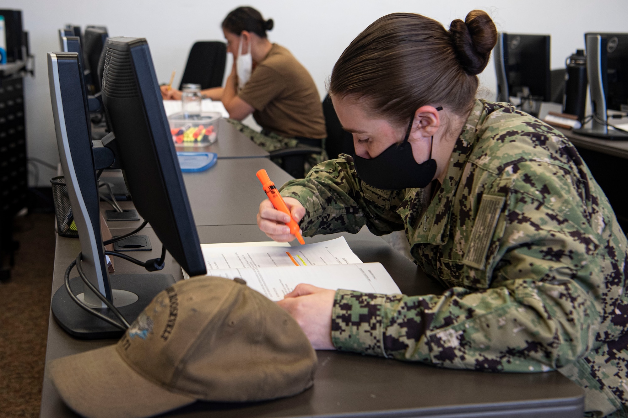 Photo of a sailor highlighting information.
