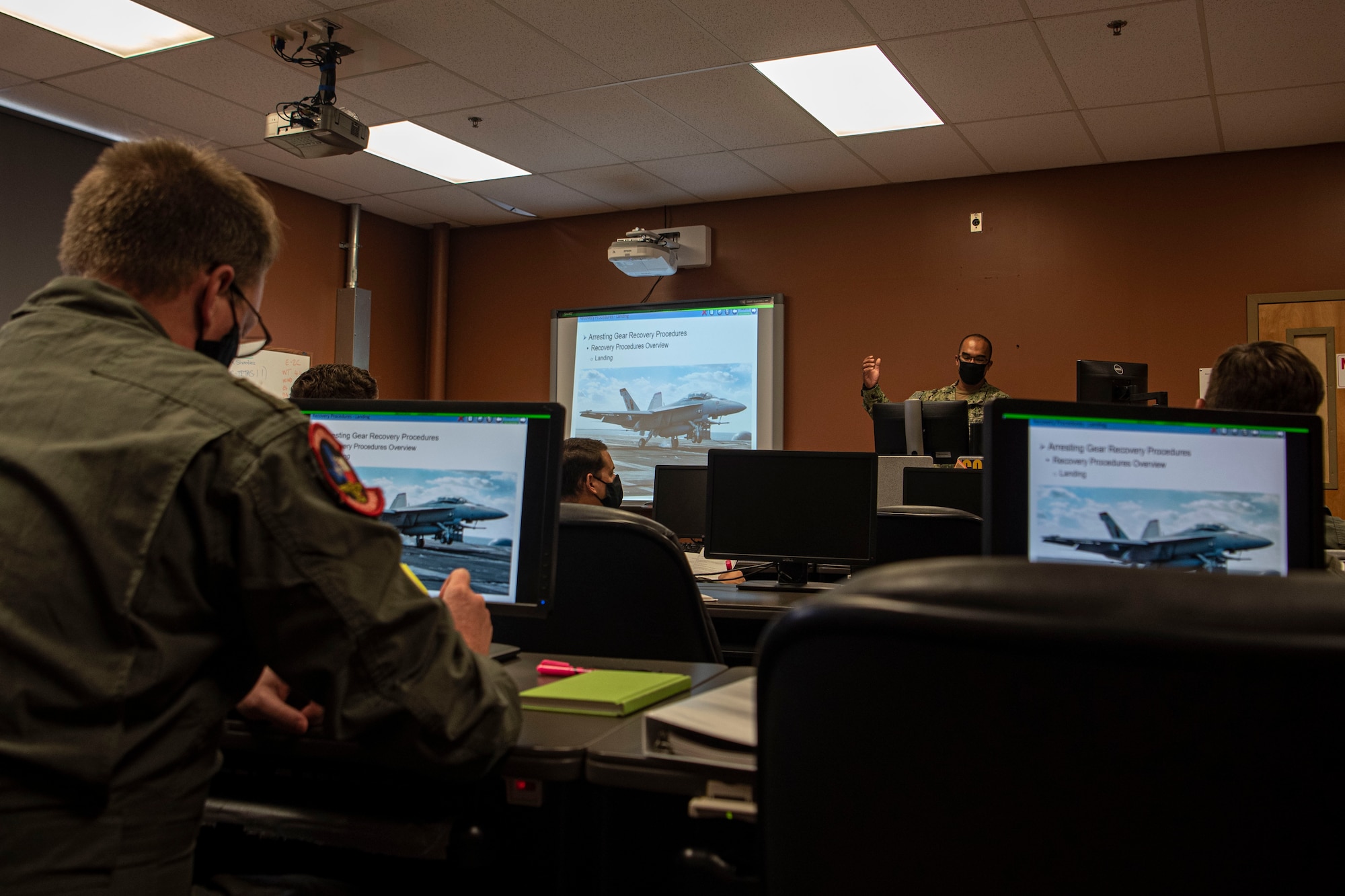 Photo of a sailor teaching a course.