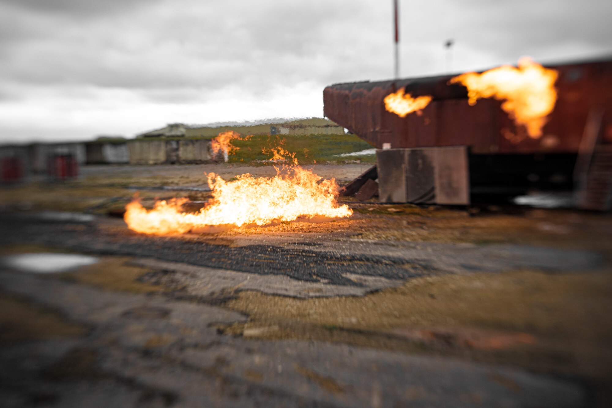 The 422d Fire Emergency Services ignites its mobile aircraft firefighting trainer in preparation for a training exercise at RAF Fairford, England, Oct. 23, 2020. The trainer allows firefighters to practice fighting fires both inside and outside an aircraft. (U.S. Air Force photo by Tech. Sgt. Aaron Thomasson)