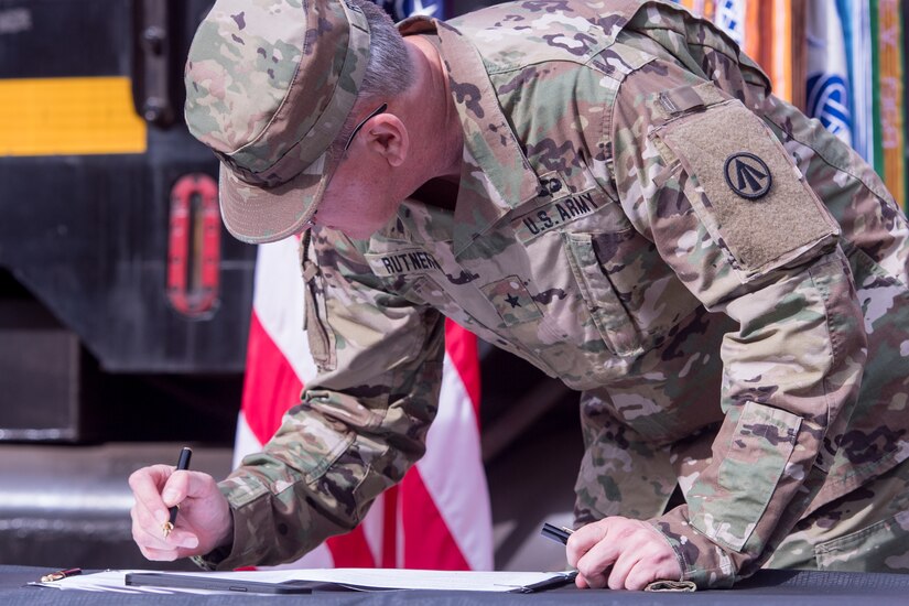 Soldier signing memorandum of agreement