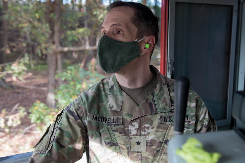 Soldier operating railcar