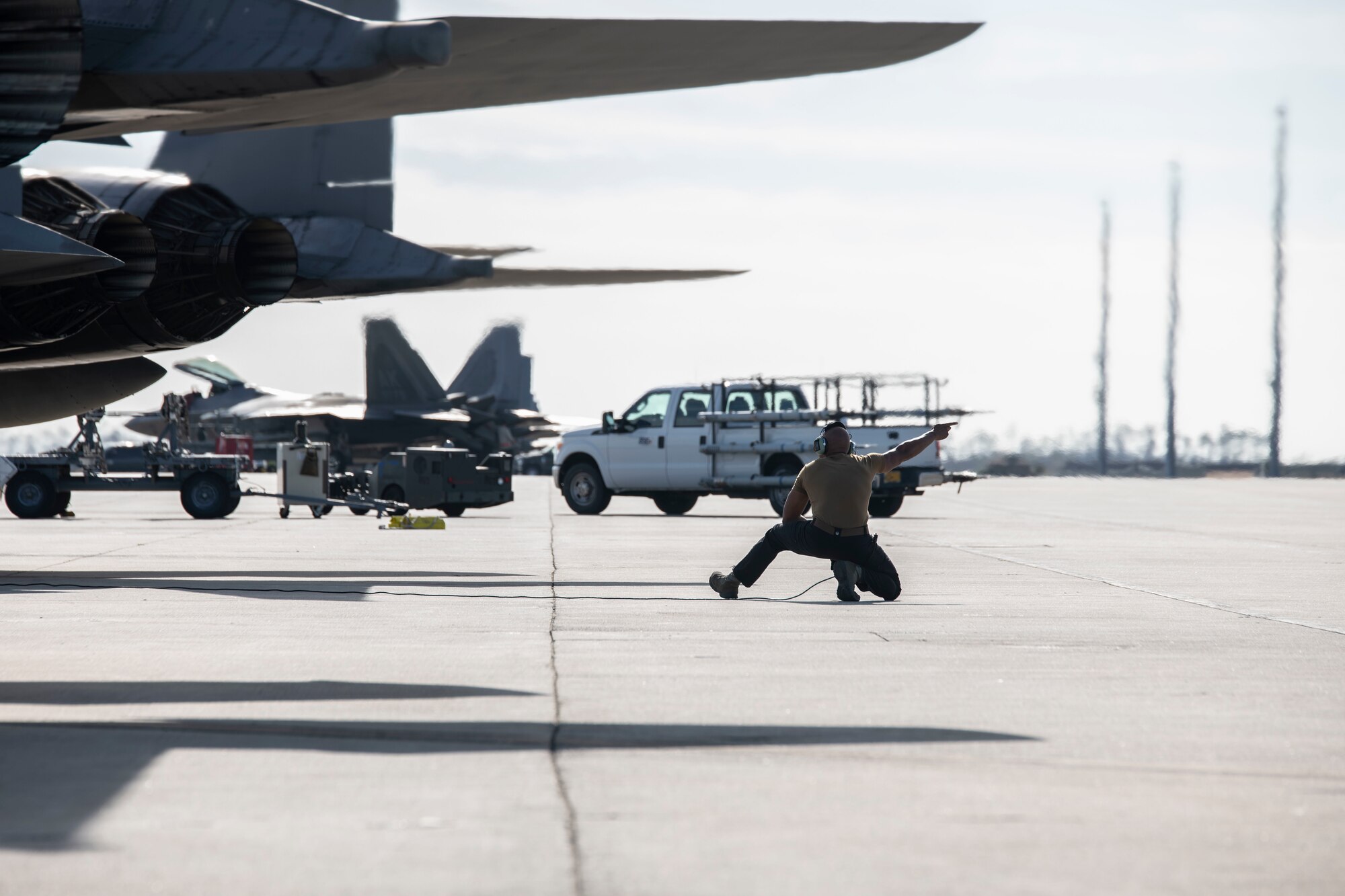 man and planes on flight line