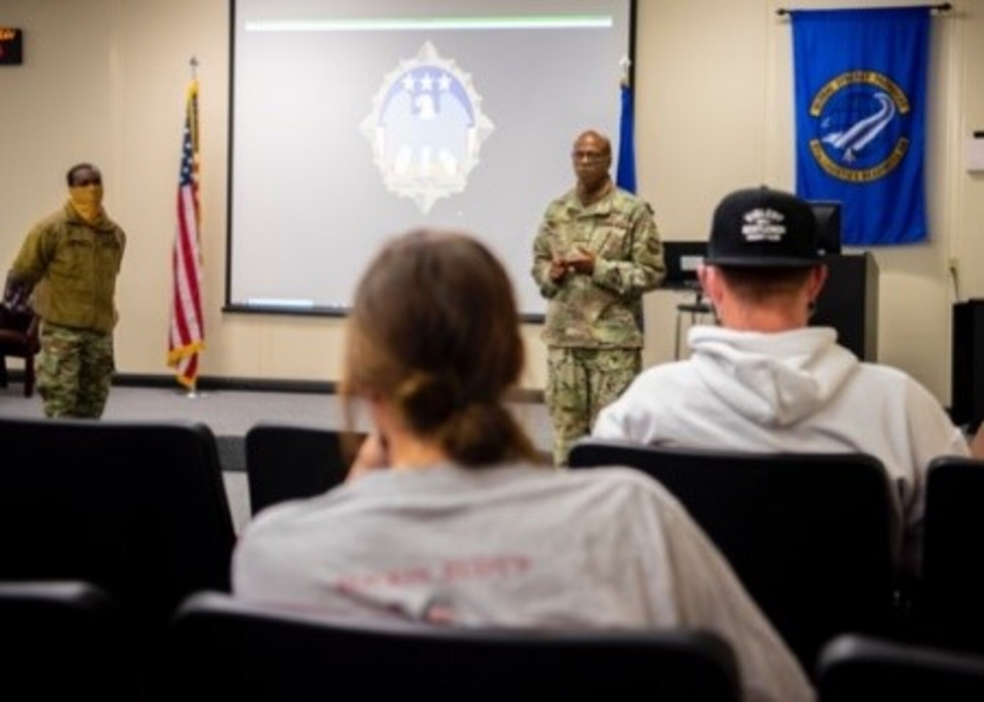 Airmen listen to a briefer.