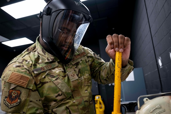 U.S. Air Force Senior Airman Myles Geter, a hydraulic systems journeyman with the 1st Special Operations Maintenance Squadron, cuts a hose using a hose-cutting machine at Hurlburt Field, Florida, Nov. 4, 2020. The 1st SOMXS supports the Air Force Special Operations Command mission by providing maintenance to all 1st Special Operations Wing aircraft, ensuring the mission is accomplished any time, any place. (U.S. Air Force photo by Airman 1st Class David Lynn)