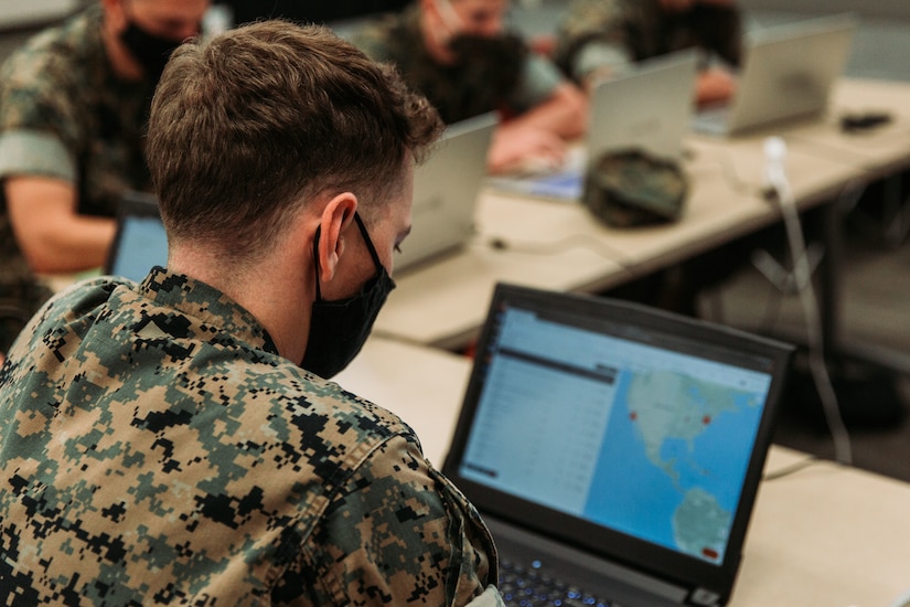 Marines use laptops.