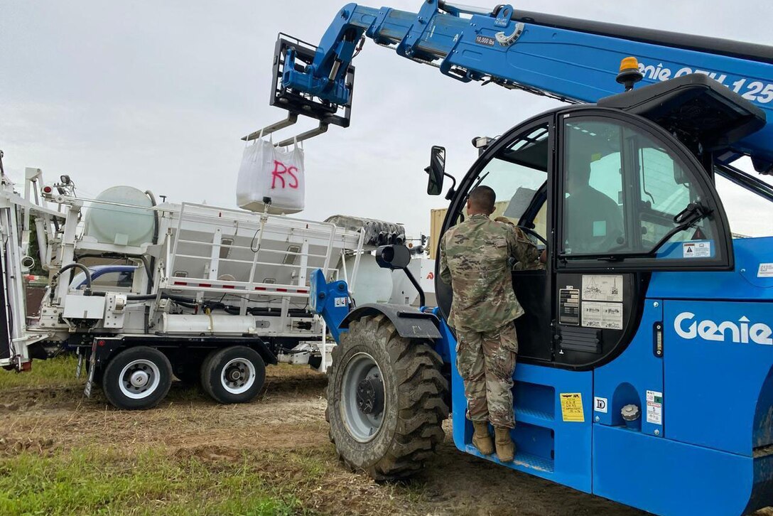 Airmen work on machinery.