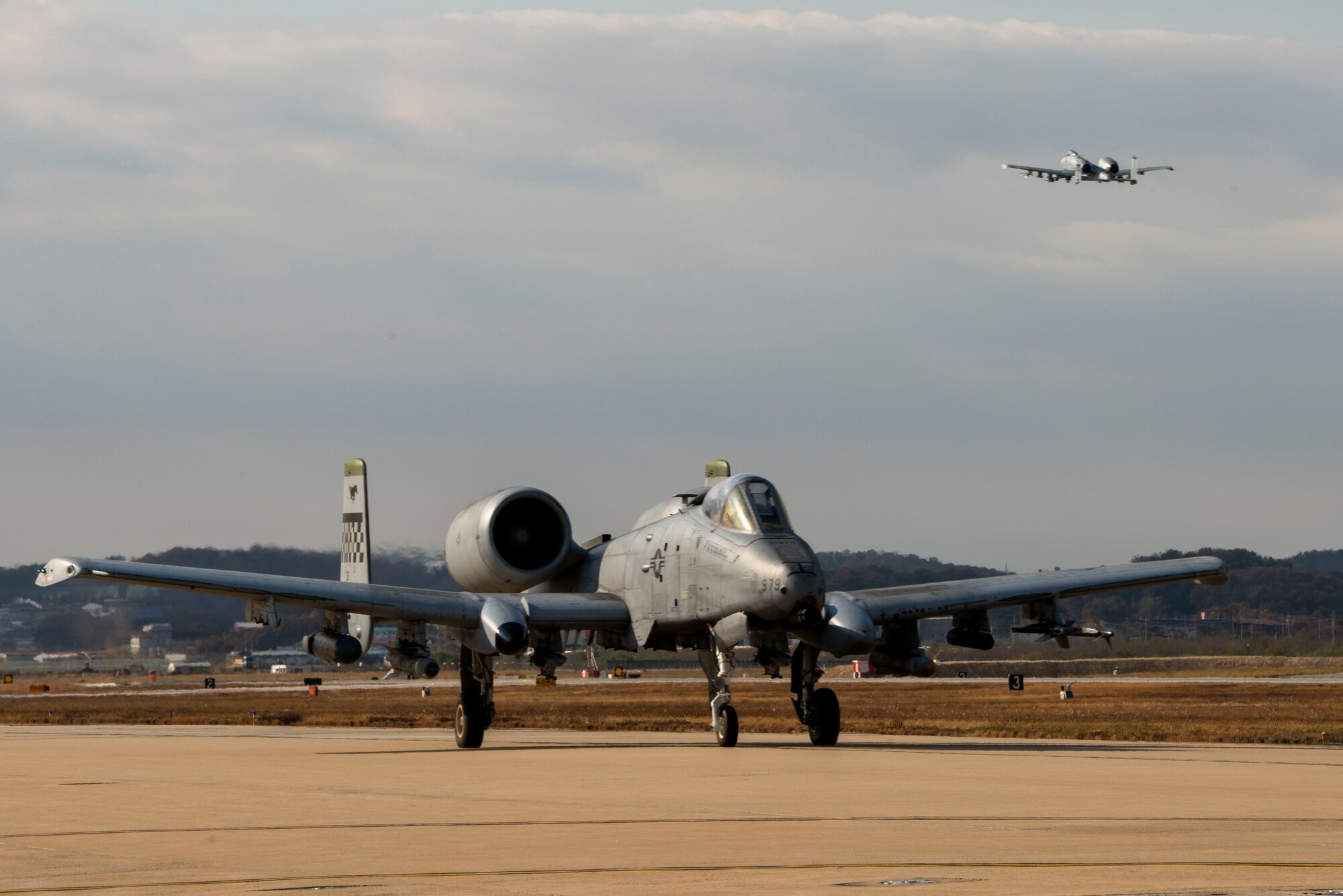 An A-10 moves down a taxiway