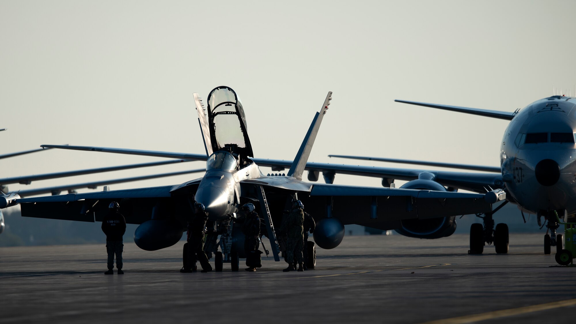 Personnel prepare an EA-18 Growler for takeoff during a Bomber Task Force mission at Misawa Air Base, Japan, Nov. 13, 2020. Bomber Task Force missions demonstrate U.S. commitment to allies and partners throughout the Indo-Pacific area of responsibility and the ability of Air Force Global Strike Command to deliver lethal strike options for combatant commanders at a moment’s notice. (U.S. Air Force photo by Staff Sgt. Grace Nichols)