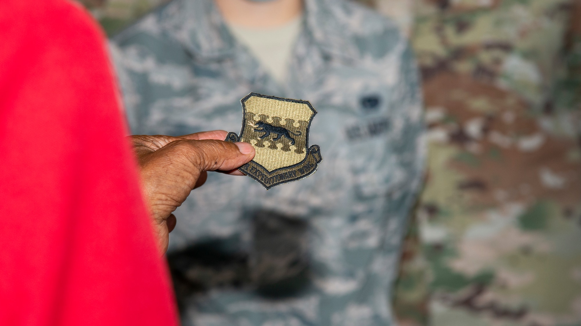 U.S. Army Air Forces Sgt. Thomas Newton, a Documented Original Tuskegee Airman, receives a 332nd Air Expeditionary Wing patch at MacDill Air Force Base, Fla., Nov. 10, 2020.
