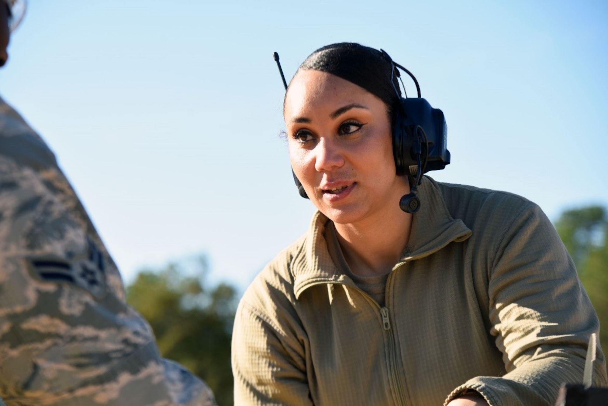 U.S. Air Force Staff Sgt. Tynisia Hains, 87th Security Forces Squadron combat arms instructor, provides feedback to an Airman during the M4 rifle qualification course at the U.S. Army Support Activity training range, Nov. 6, 2020, on Joint Base McGuire-Dix-Lakehurst, N.J. This qualification course will prepare Airmen for deployment in the future. (U.S. Air Force photo by Daniel Barney)