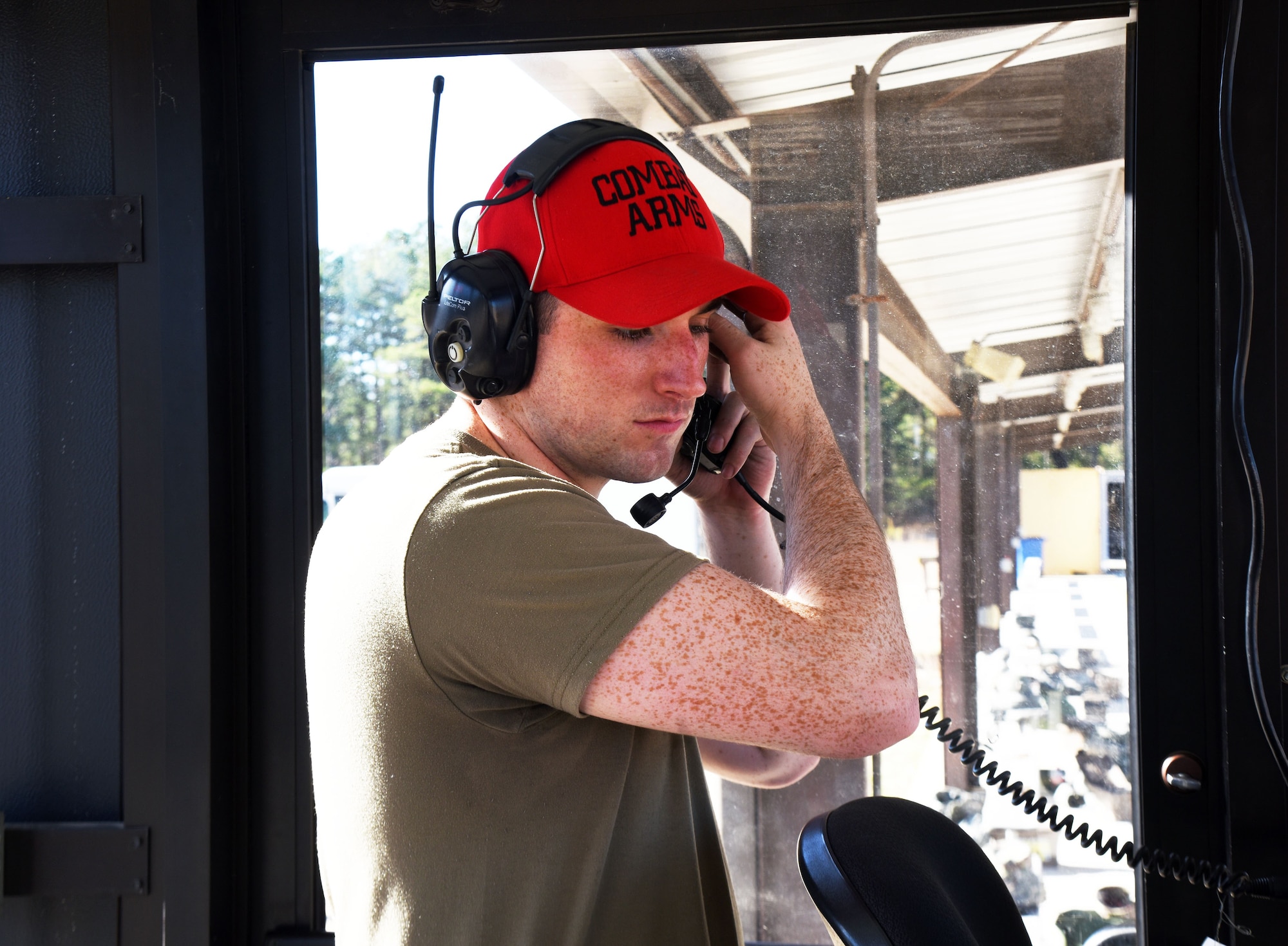 U.S. Air Force Staff Sgt. Tyler Rouillard, 87th Security Forces Squadron combat arms instructor, puts on his headphones to prepare for the next session of the M4 rifle qualification course at the U.S. Army Support Activity training range, Nov. 6, 2020, on Joint Base McGuire-Dix-Lakehurst, N.J. This qualification course will prepare Airmen for deployment operations in the future. (U.S. Air Force photo by Daniel Barney)