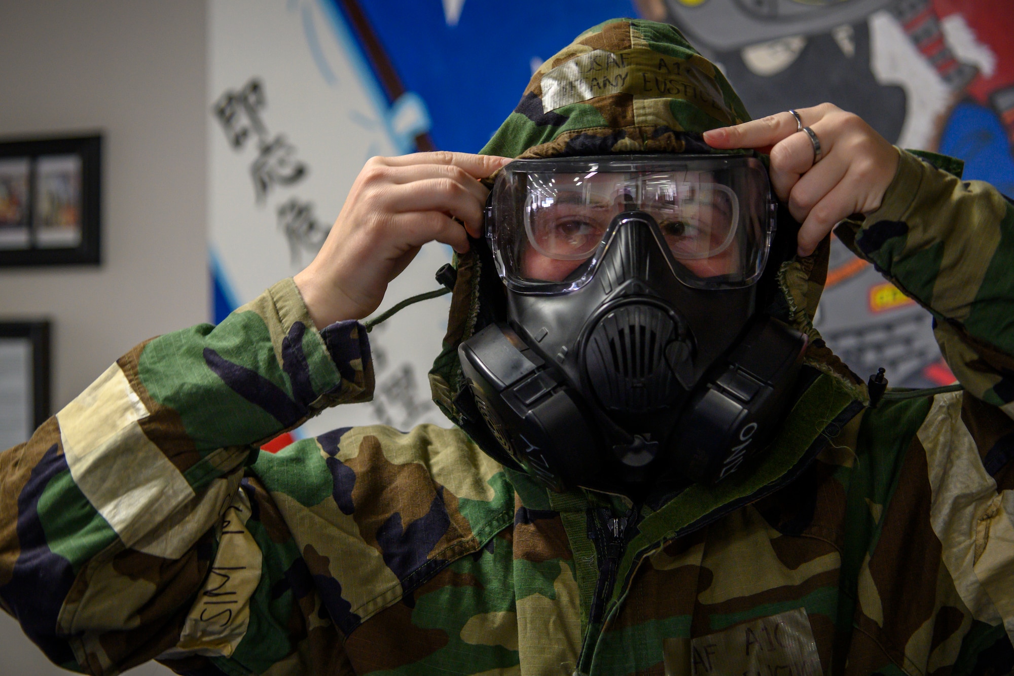 U.S. Air Force Airman 1st Class Tiffany Eustice, a 35th Civil Engineer Squadron emergency manager, puts on mission oriented protective posture gear at Misawa Air Base, Japan, Nov. 12, 2020. Airmen are exposed to high heat stress environments while in MOPP gear and this vest worn underneath the gear allows for constant cooling of the Airmen’s core temperature. In response to the MOPP gear areas of improvement, RINI Technologies, a company that provides innovative solutions to thermal-management challenges out of Florida, submitted a proposal for a MOPP cooling system that cools down the vest while being worn. (U.S. Air Force photo by Airman 1st Class China M. Shock)