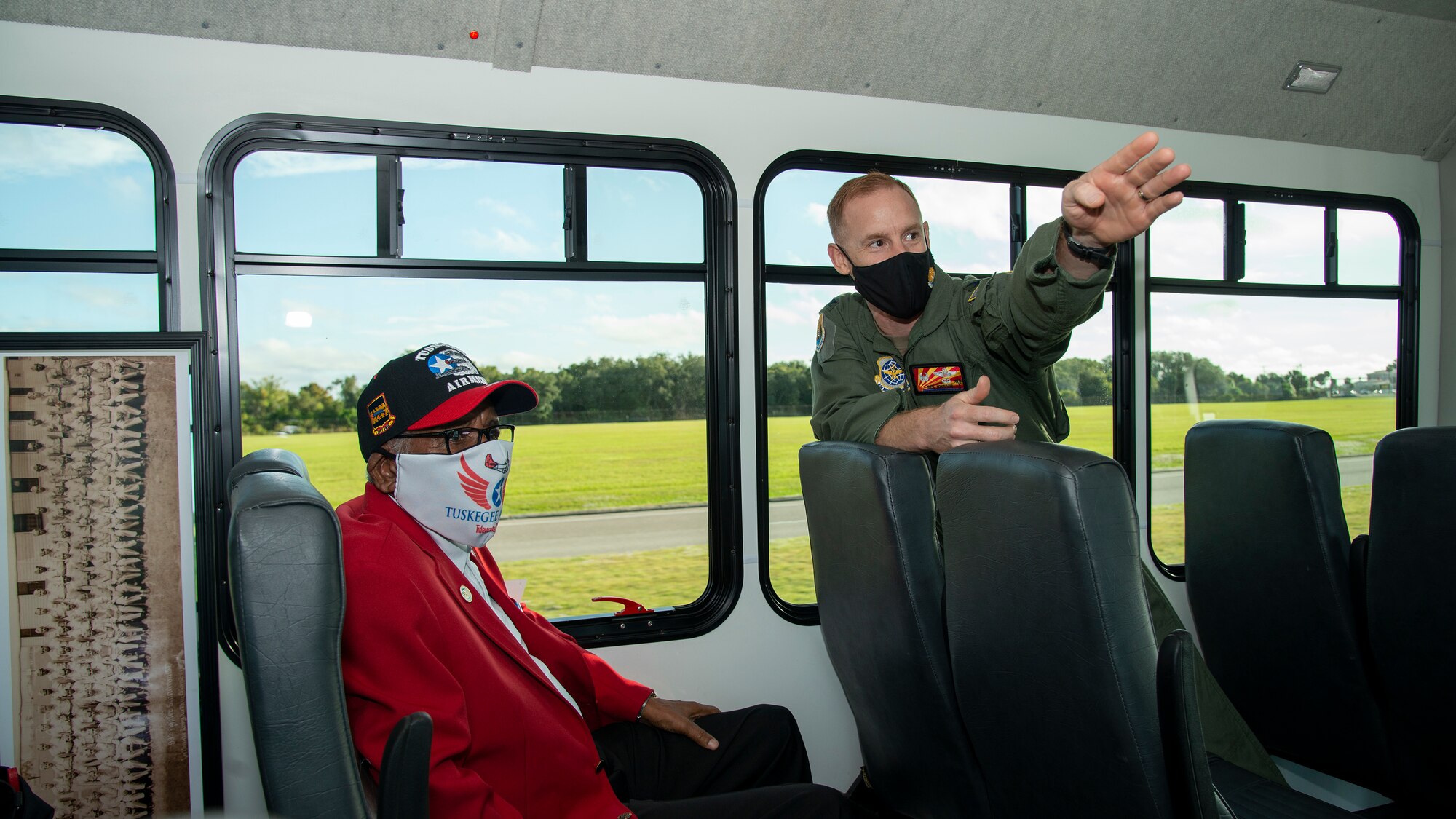 U.S. Air Force Col. Benjamin Jonsson, the 6th Air Refueling Wing commander, guides U.S. Army Air Forces Sgt. Thomas Newton, a Documented Original Tuskegee Airman, on a tour of MacDill Air Force Base, Fla., Nov. 10, 2020.