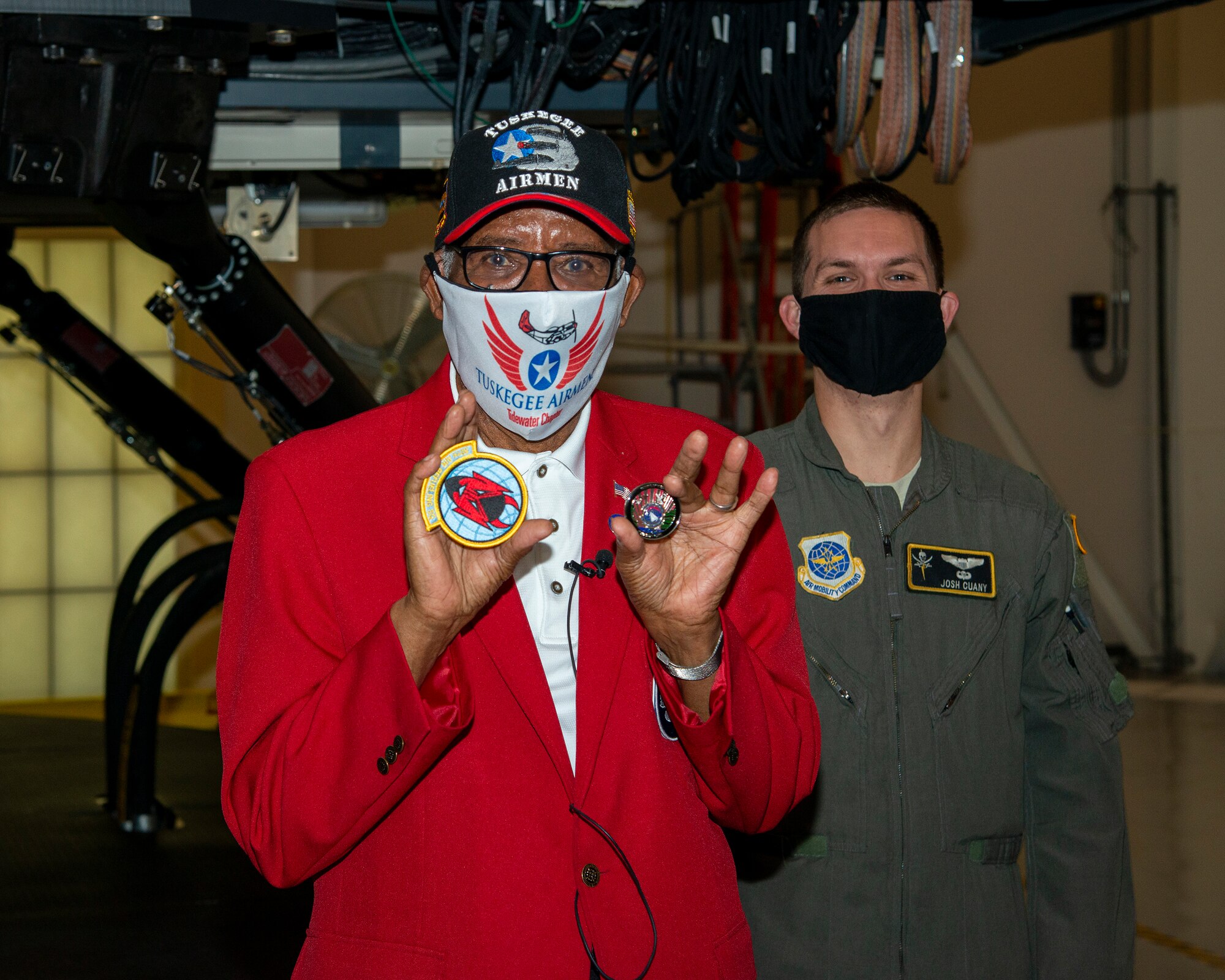 U.S. Army Air Forces Sgt. Thomas Newton, a Documented Original Tuskegee Airman, displays a 50th Air Refueling Squadron (ARS) patch and coin at MacDill Air Force Base, Fla., Nov. 10, 2020.