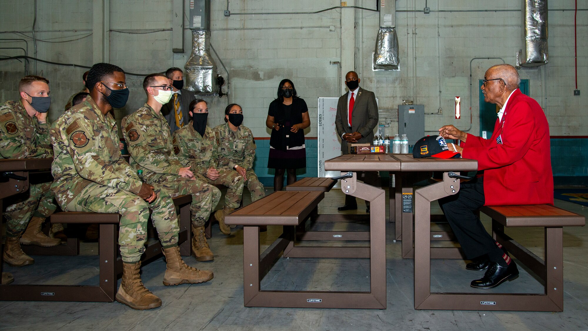 U.S. Army Air Forces Sgt. Thomas Newton, a Documented Original Tuskegee Airman, speaks to 6th Logistics Readiness Squadron Airmen at MacDill Air Force Base, Fla., Nov. 10, 2020.