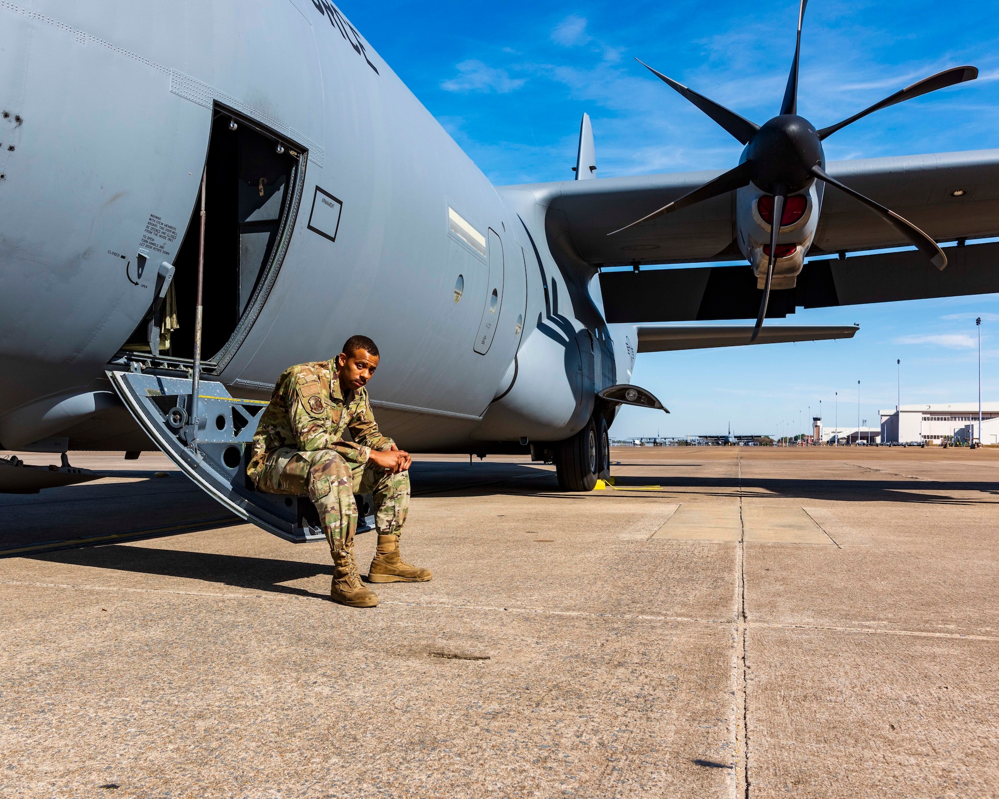 Air Force Reserve Senior Amn Edward Hunter, 913th Maintenance crew chief, poses on the steps of a C-130J Super Hercules at Little Rock Air Force Base, Ark, Nov. 4, 2020. Most recently, Hunter volunteered to help the Hurricane Hunters based out of Kessler AFB, Mississippi, to ensure that the aircraft were ready to fly at a moment’s notice carry out the numerous National Oceanic and Atmospheric Administration missions this season.