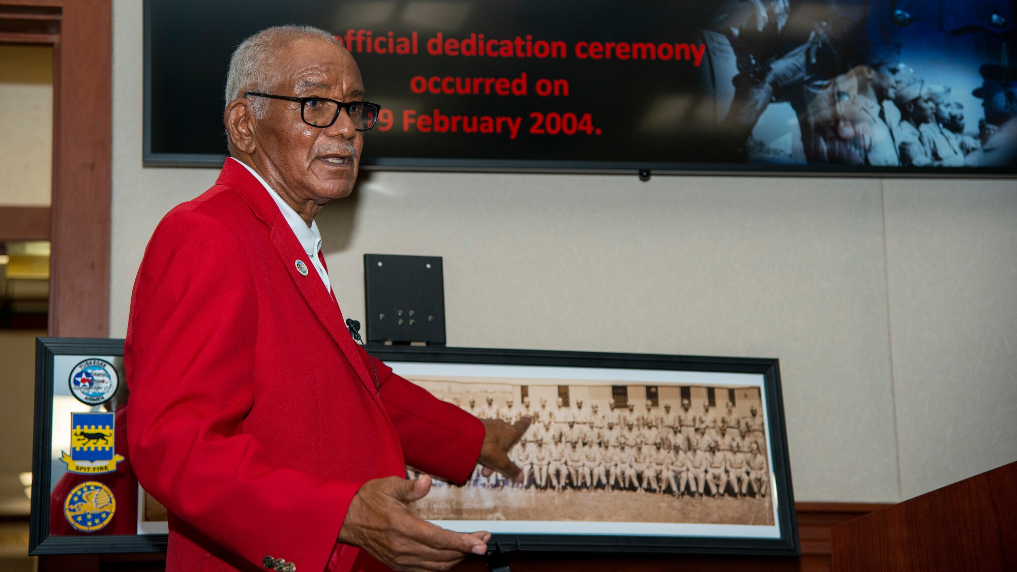 U.S. Army Air Forces Sgt. Thomas Newton, a Documented Original Tuskegee Airman, points to himself on a photo of the 99th Fighter Squadron following World War II at MacDill Air Force Base, Fla., Nov. 10, 2020.