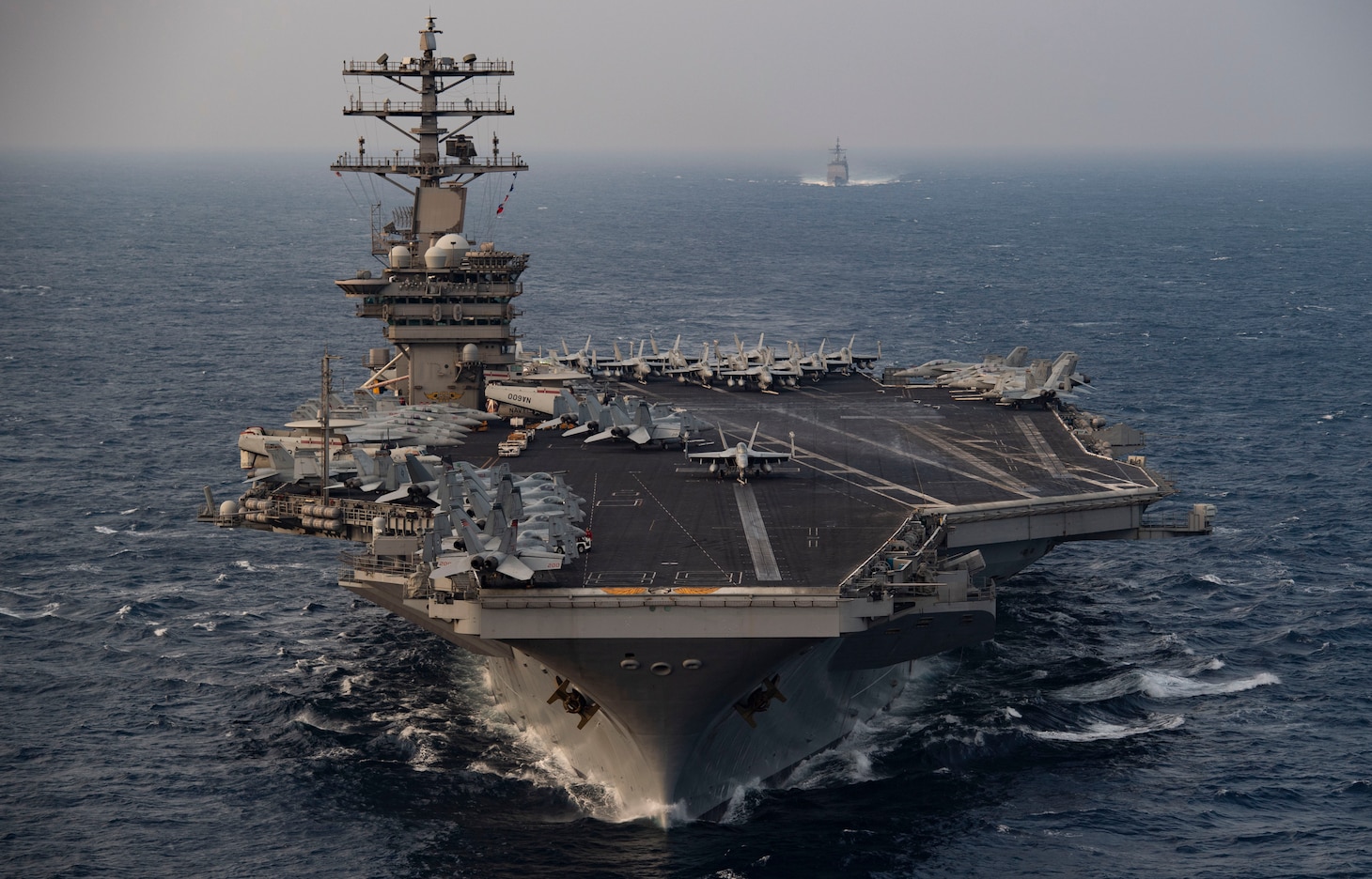 NORTH ARABIAN SEA (Nov. 17, 2020) The aircraft carrier USS Nimitz (CVN 68) steams ahead of the guided-missile cruiser USS Princeton (CG 59) while participating in Malabar 2020 in the North Arabian Sea. Malabar 2020 is the latest in a continuing series of exercises that has grown in scope and complexity over the years to address the variety of shared threats to maritime security in the Indo-Asia Pacific where the U.S. Navy has patrolled for more than 70 years promoting regional peace and security. Nimitz Carrier Strike Group is currently deployed to the 7th Fleet area of operations in support of a free and open Indo-Pacific.