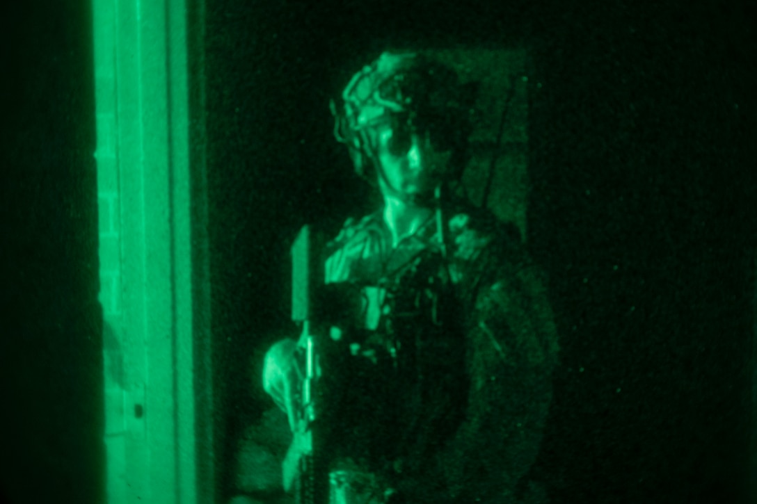 A U.S. Marine executes a direct-action night raid during Training Exercise II at Marine Corps Base Camp Lejeune, N.C., July 26.