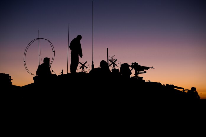 U.S. Marines establish communications from a light armored vehicle in preparation for a forward arming and refueling point operation at Marine Corps Base Camp Pendleton, Calif., Oct. 13.