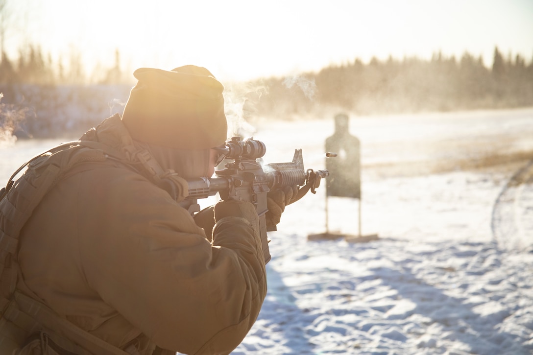 A U.S. Marine fires an M4 carbine during a live-fire range at Eielson Air Force Base, Alaska, Oct. 17.