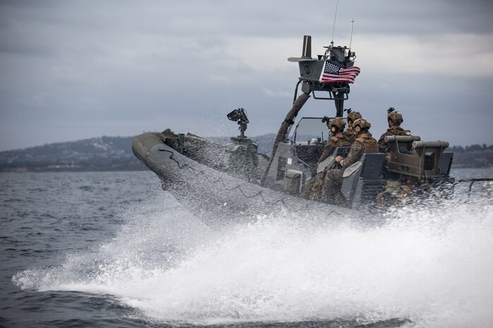 U.S. Marines maneuver an 11M naval special warfare rigid-hull inflatable boat through the ocean during a small boat training event, Oct. 24.