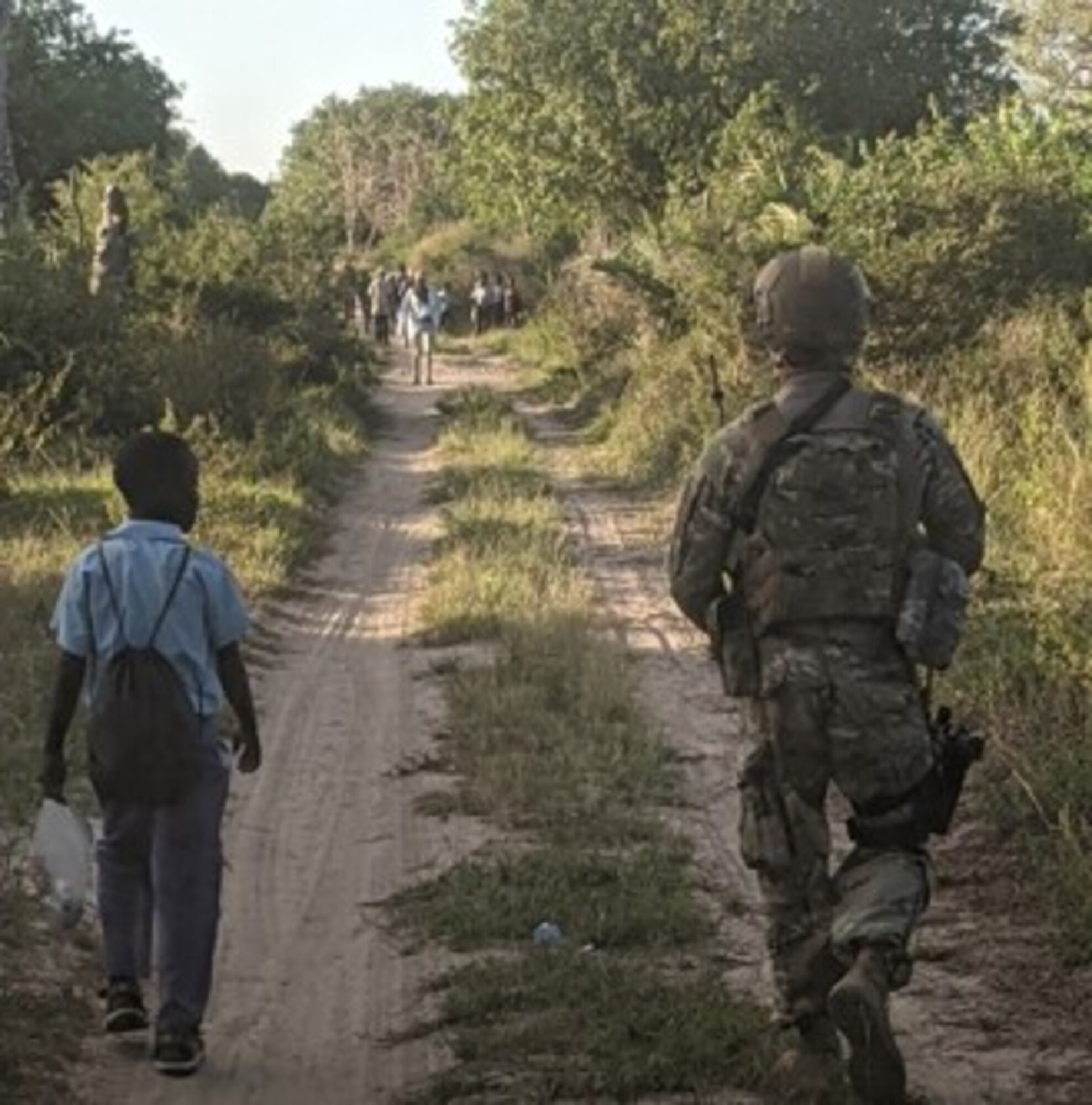 U.S. Air Force Master Sgt. Bennie Prescott, 475th Expeditionary Air Base Squadron plans and programs section chief, talks about life with a resident expert from Magogoni Village, at Manda Bay, Kenya, Nov. 6, 2020.