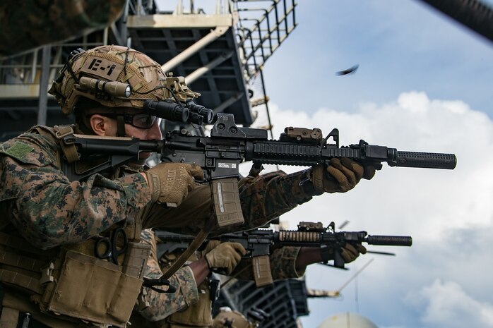 A U.S. Marine fires a M27 Infantry Automatic Rifle during a live fire exercise aboard amphibious assault ship USS America (LHA 6), Oct. 3.