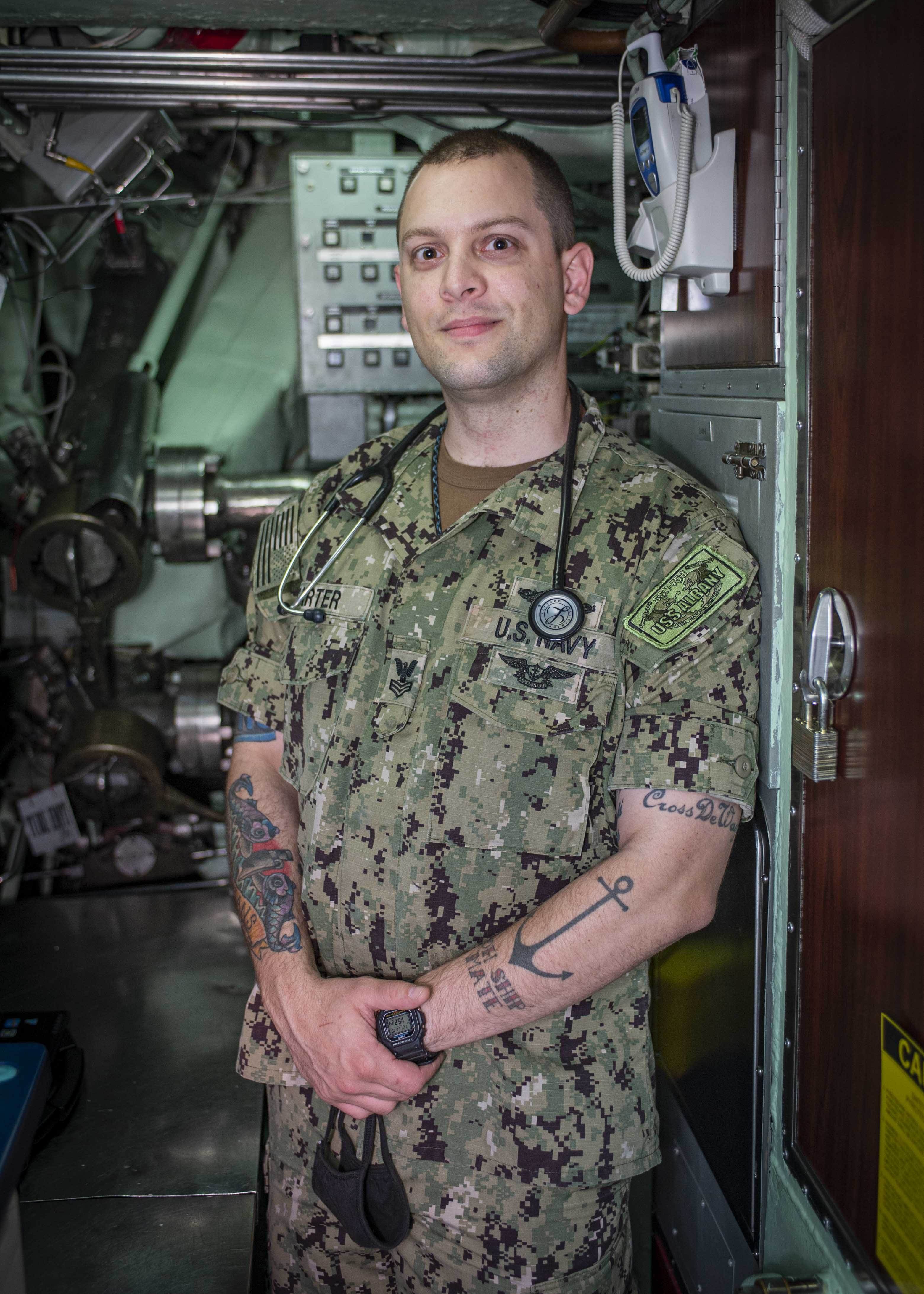 Hospital Corpsman 1st Class Matthew Carter poses for a portrait photograph aboard the Los Angeles-class attack submarine USS Albany (SSN 753) Nov. 10, 2020.