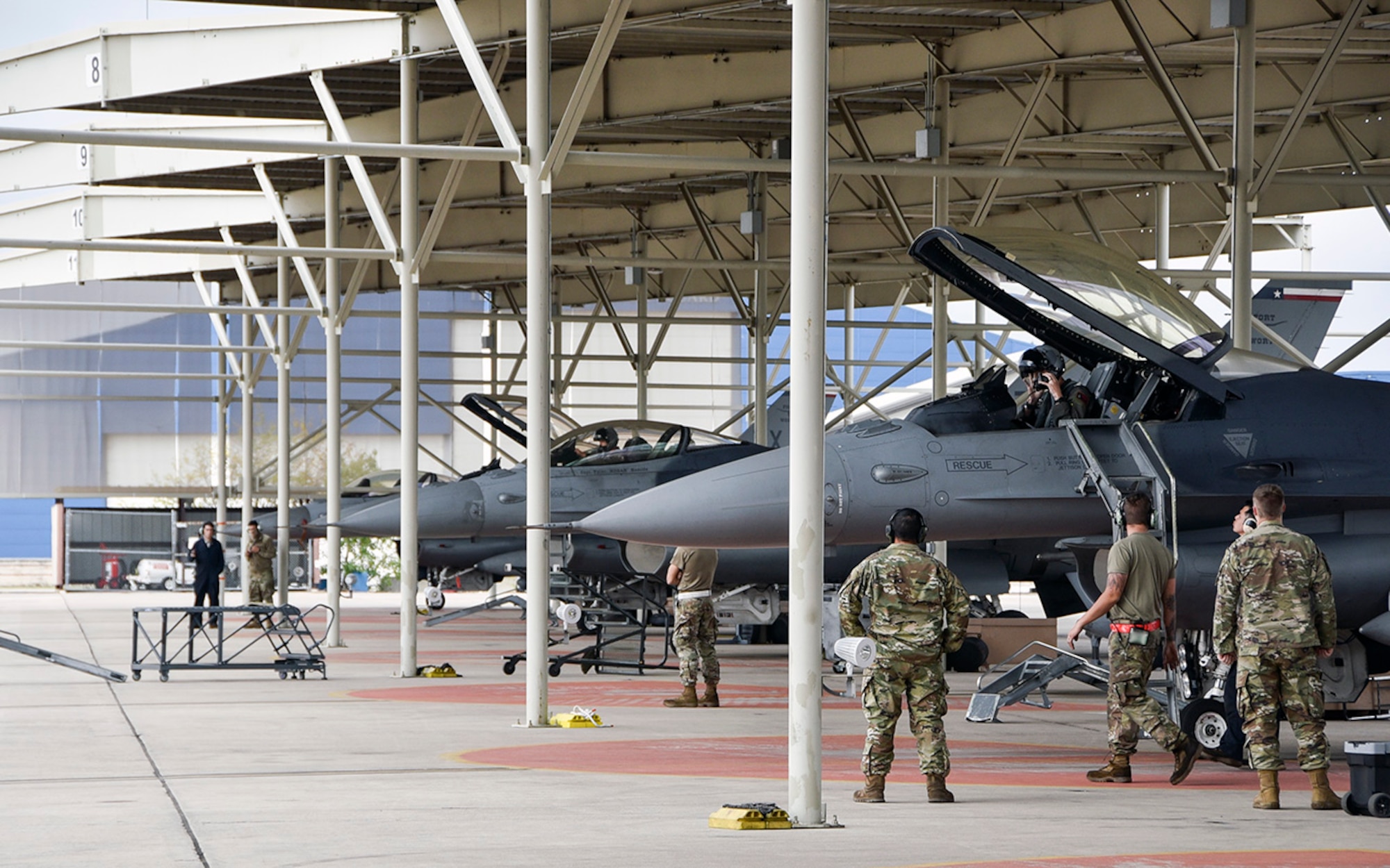 U.S. Air Force Airmen prepare their F-16 Fighting Falcons for flight during their super Unit Training Assembly at U.S. Naval Air Station Joint Reserve Base Fort Worth, Texas, on Nov. 8, 2020. Airmen assigned to the 301st Fighter Wing's Maintenance and Aircraft Maintenance Squadrons participated in a surge in order to generate a higher number of sorties around the clock. (U.S. Air Force photo by Senior Airman Kedesha Pennant)