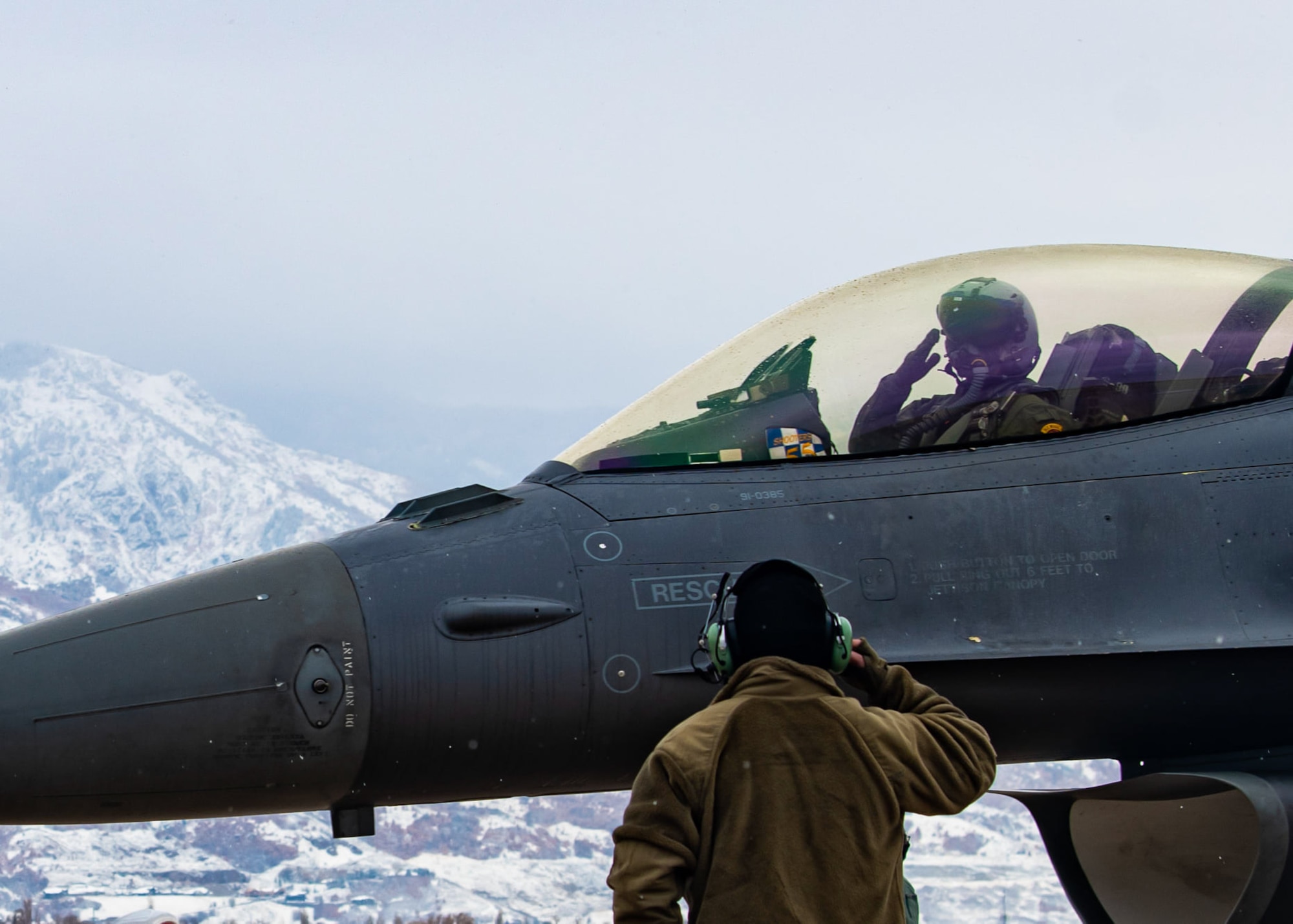 Image of an Airman marshalling out his F-16 pilot
