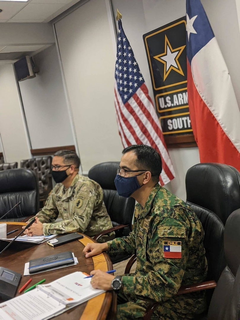Col. Andrew Rendon, U.S. Army South, and Col. Jorge Salinas, Chilean Army Liaison Officer, listens to opening remarks at the beginning of the U.S.-Chilean Army Staff Talks.