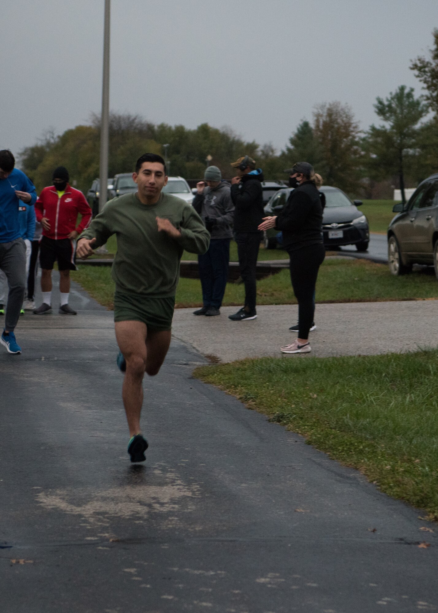 U.S. Marine Corps Sgt. Christian, 20th Attack Squadron sensor operator runs in the SAPR 5K.