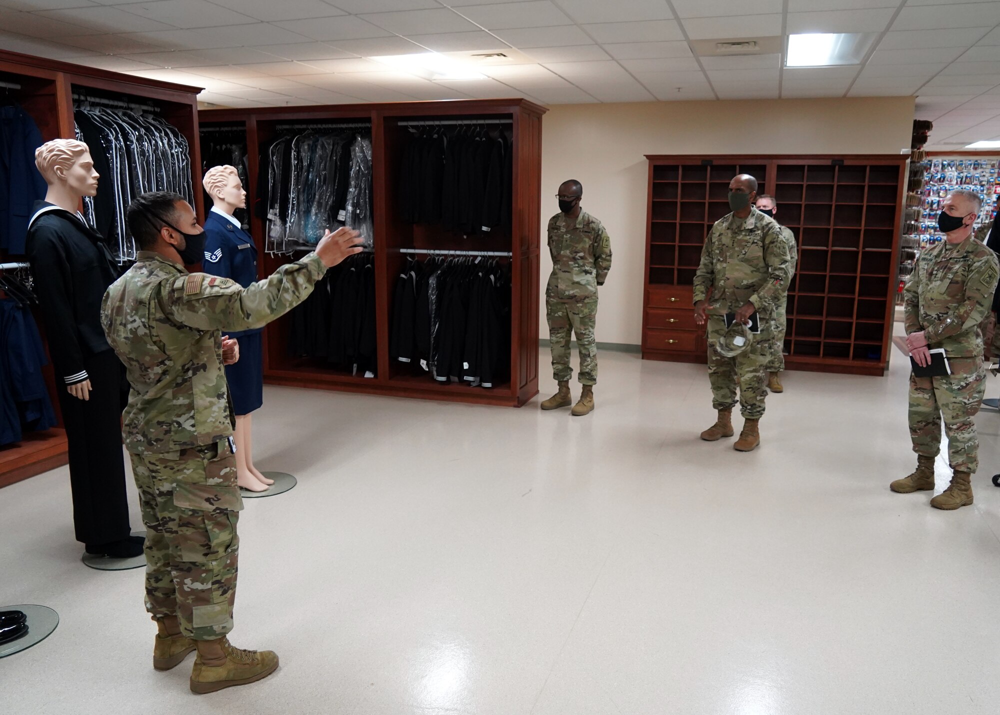 Senior Airman Will Cabreja-Lozada, Air Force Mortuary Affairs Operations uniforms section lead, briefs U.S. Army Office of the Deputy Chief of Staff for Personnel and Chaplain Corps leadership, Nov. 13, 2020, Dover Air Force Base, Delaware. Accompanied by Chaplain (Maj. Gen.) Thomas Solhjem, Army Chief of Chaplains, and Chaplain (Brig. Gen.) William Green Jr., Deputy Chief of Chaplains, Brito was shown steps AFMAO takes to ensure each family and fallen service member is met with dignity, honor and respect. (U.S. Air Force photo by Staff Sgt. Benjamin N. Valmoja)