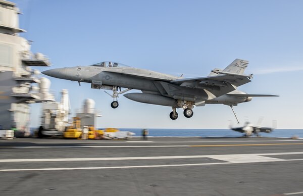 An F/A-18E Super Hornet attached to the "Pukin' Dogs" of Strike Fighter Squadron (VFA) 143 prepares to land on the flight deck of the aircraft carrier USS Gerald R. Ford (CVN 78) Nov. 14, 2020.