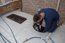 A photo of an Airman performing emergency procedures