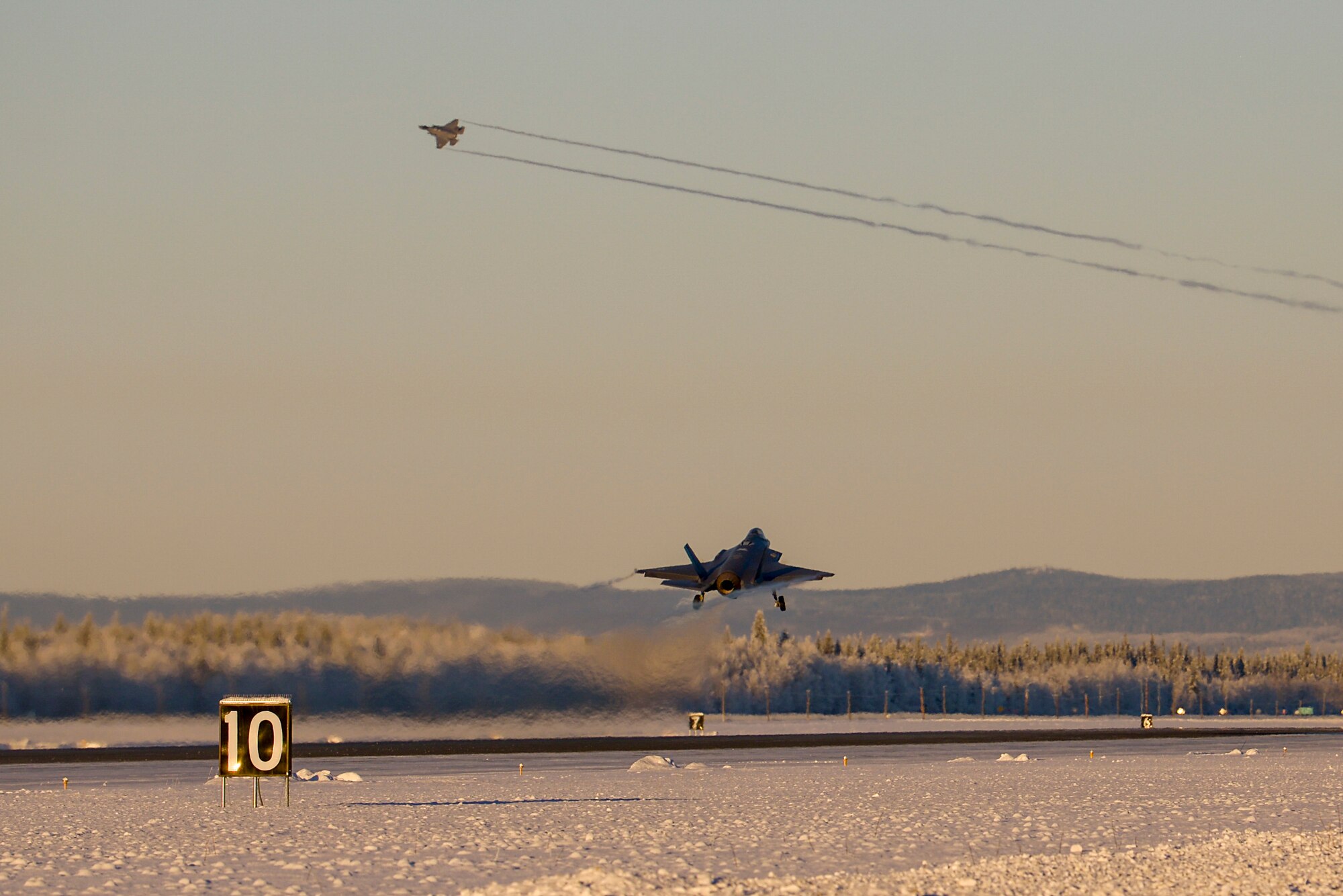 An F-35A Lightning II, assigned to the 356th Fighter Squadron, takes off during Arctic Gold 21-1 on Eielson Air Force Base, Alaska, Nov. 17, 2020. The F-35As at Eielson are strategically placed in Alaska to support the Pacific Theater and deter near-peer adversaries. (U.S. Air Force photo by Senior Airman Beaux Hebert)
