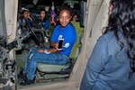 Students from Valley High School in Sacramento, Calif., take photos of themselves inside a Humvee during a tour of Travis Air Force Base, Calif., Oct. 20, 2016.