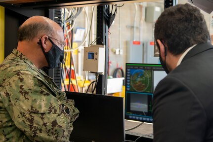 (Nov. 17, 2020) - Chief of Naval Operations (CNO) Adm. Mike Gilday receives a brief on the Optical Dazzler Interdictor (ODIN) at Naval Surface Warfare Center (NSWC) Dahlgren, Virginia, Nov. 17. CNO traveled to Dahlgren to visit Sailors and civilians and receive briefs on a variety of programs like High Energy Lasers, Solid Laser Technology Maturation (SSL-TM) and Layered Laser Defense (LLD).  (U.S. Navy photo by Lieutenant Rachel Maul/Released)