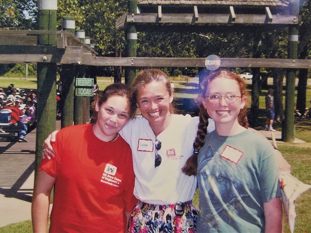 Linda Finley poses with her daughters Morgan, left, and Jackie, right, during the 2004 Sacramento District picnic. Both of Finley's daughters have grown up to become engineers as well.