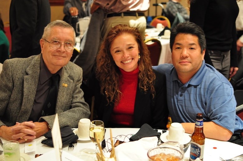 Linda Finley at the 2009 Sacramento District Holiday Party and Awards Presentation with her father, left, and husband Keith, right. Finley received her 30-year length of service award at the event.